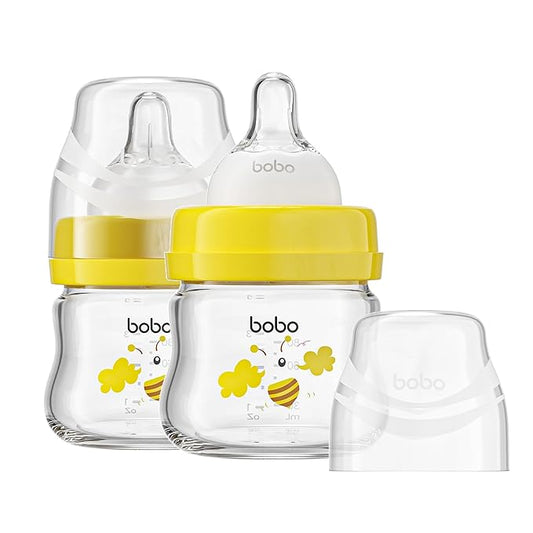 YOHKOH Glass Baby Bottles with Slow Flow Nipple, Newborn Anti-Colic Baby Bottles for 0+ Months, Wide Neck Feeding Bottle, Clear (Yellow, 2.7oz (Pack of 2))