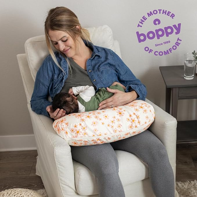 Boppy Nursing Pillow - Firm, Ergonomic U-Shaped Bottle and Breastfeeding Pillow with High Lift for Comfort and Support, Spacious Surface - Soft Pink Daisies