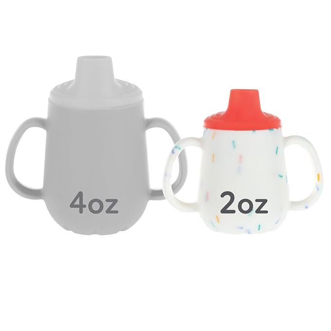 Nuby First Training Cup - Silicone Cup with Free-Flow Spout and Easy-Grip Design - 2 oz - 6+ Months - Coral and Sprinkles