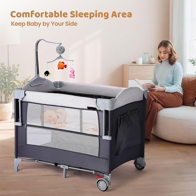 JOYMOR 5-in-1 Pack and Play with Bassinet and Changing Table, Lightweight Travel Crib, Foldable Baby Playard, Waterproof Changing Top, Carry Bag & Wheels