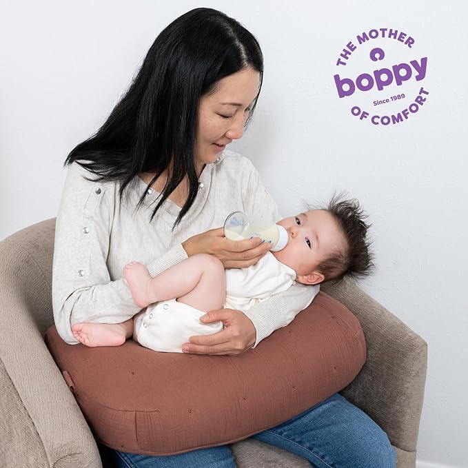 Boppy Nursing Pillow Luxe - Ergonomic Bottle & Breastfeeding Pillow with High Lift & Firm Support - Water-Resistant with Washable Cotton Muslin Cover - Baby Safety Alliance Verified - Chestnut