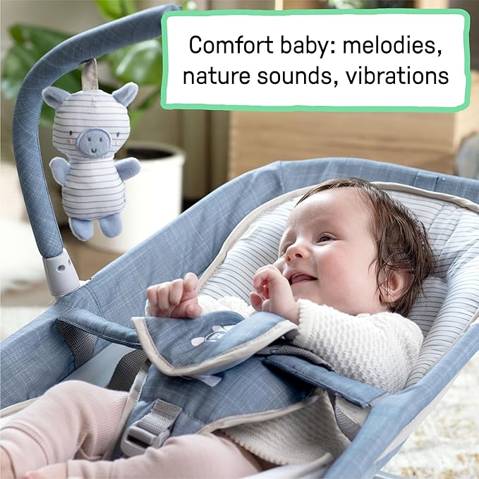 Ingenuity Gas Relief and Anti-Colic Baby Bouncer Seat and Rocker, Gentle Belly Massage to Relax and Soothe Bellies, Instant Tummy Soother, 20 Songs and Melodies – Chambray Blue