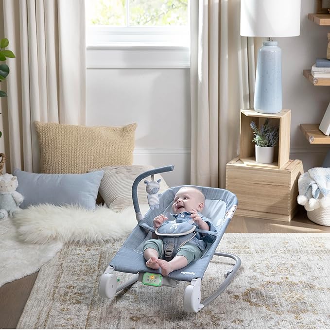 Ingenuity Gas Relief and Anti-Colic Baby Bouncer Seat and Rocker, Gentle Belly Massage to Relax and Soothe Bellies, Instant Tummy Soother, 20 Songs and Melodies – Chambray Blue